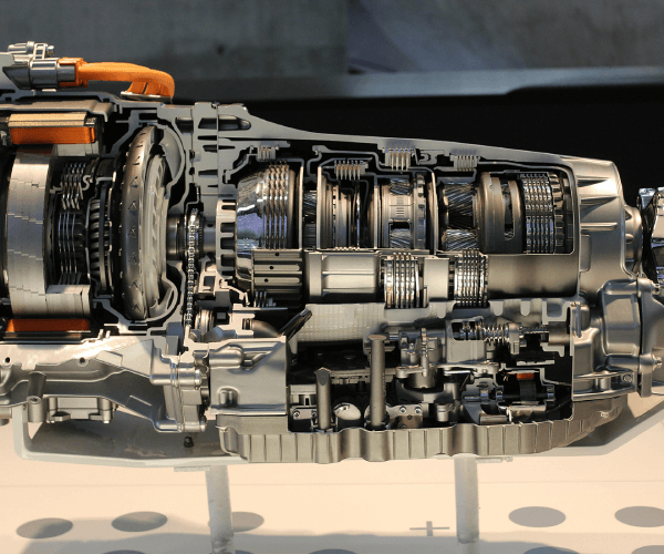 Transmissions and automotive powertrain assemblies